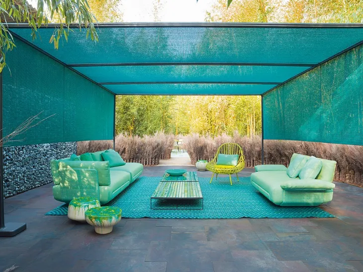 Poltroncina Giunco in alluminio rivestito in filato treccia di Paola Lenti